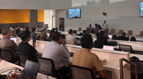 Lecture hall filled with attendees for the Science x AI Summit held at UC Riverside
