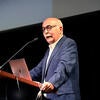 UCR Distinguished Professor of Physics and Astronomy, Bahram Mobasher, speaking at a podium.